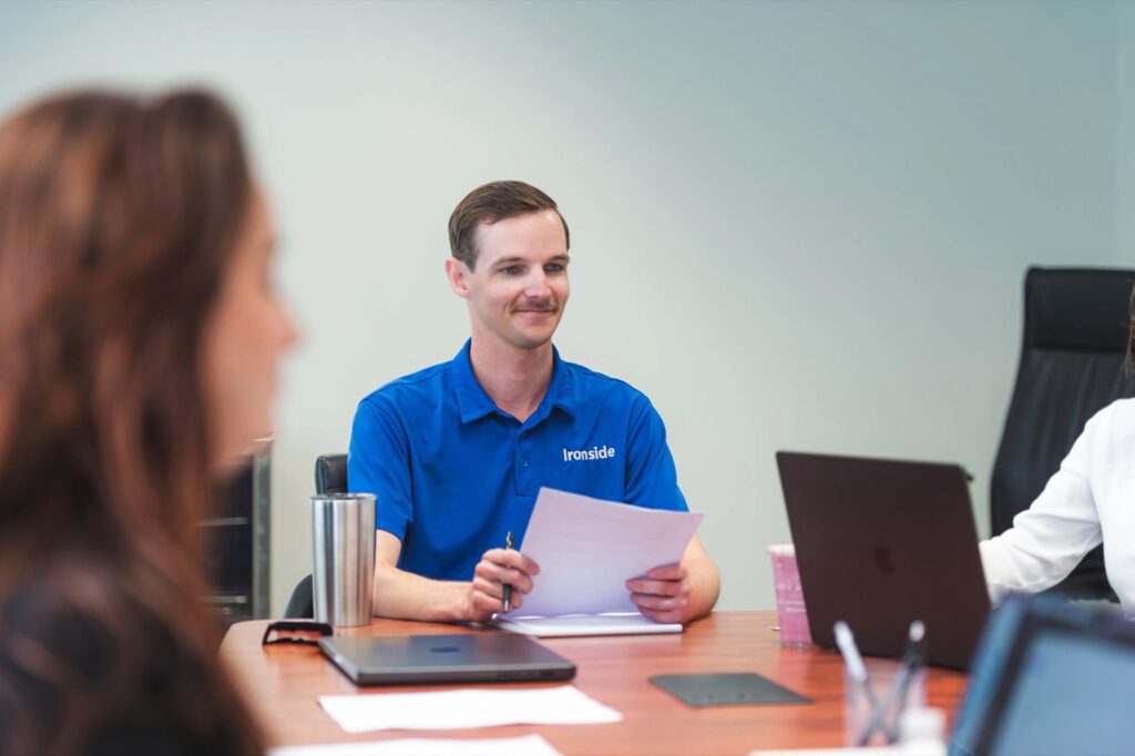 Ironside team member reviewing a press release draft during a client public relations meeting in Vero Beach
